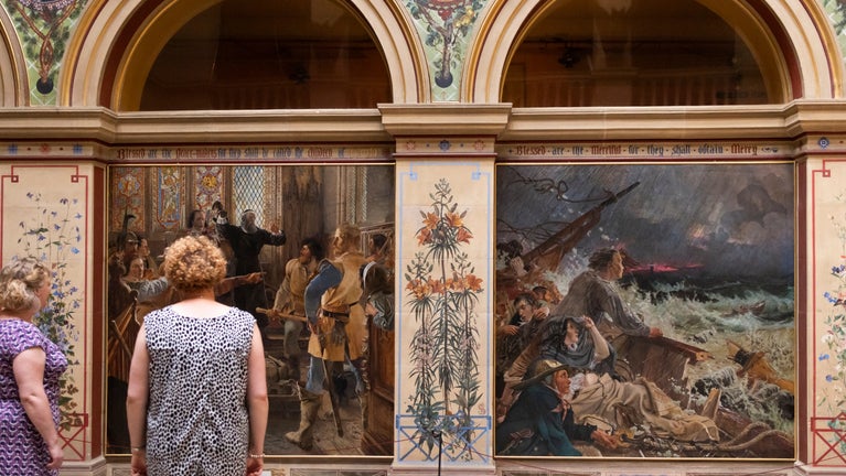 Visitors enjoying the paintings in the Central Hall at Wallington